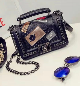 Pure leather designer purse, with badges