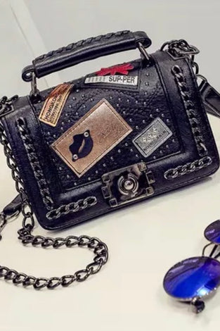 Pure leather designer purse, with badges