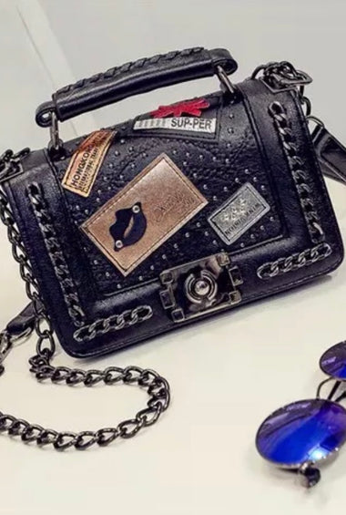 Pure leather designer purse, with badges